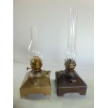 Two industrial type oil lamps on stepped square bases, British Rail (Midland)