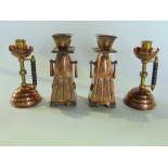 A good pair of copper and brass candlesticks in the manner of Christopher Dresser, 16 cm high approx