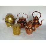 A collection of metalware to include three copper kettles, a twin handled brass vessel and a further