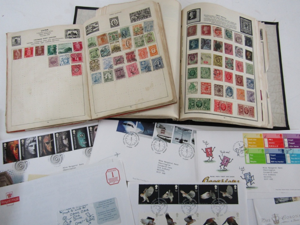 Two stamp albums containing a quantity of British and worldwide stamps including a Penny Red example