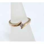 A 9ct gold ladies diamond ring with single square cut diamond. Estimated diamond weight 0.22ct, Size