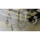 A good quality neo classical style cast brass eight branch electrolier with foliate and further