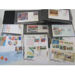 A box containing two albums and three folders of Australia stamps and fdc's + some loose covers