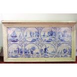 A set of eight Delft type blue and white painted tiles with decoration including coastal scenes,
