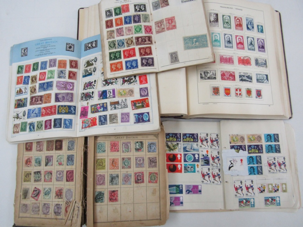A stamp album containing a large collection of French stamps, three further stamp albums