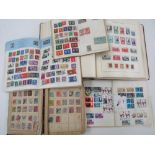 A stamp album containing a large collection of French stamps, three further stamp albums