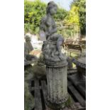 A weathered contemporary composition stone garden ornament in the form of a classical female in
