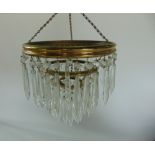 Two similar crystal drop ceiling lights.