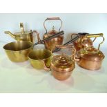 A collection of antique metalwares to include three antique copper kettles, brass watering can and