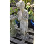 Two weathered cast composition stone garden ornaments in the form of classical maidens in varying