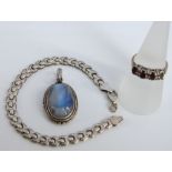 A large labradorite and silver pendant, a garnet and silver gilt ladies ring (1 stone deficient) and