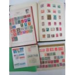 Three stamp albums containing a collection of British and worldwide stamps including some Penny