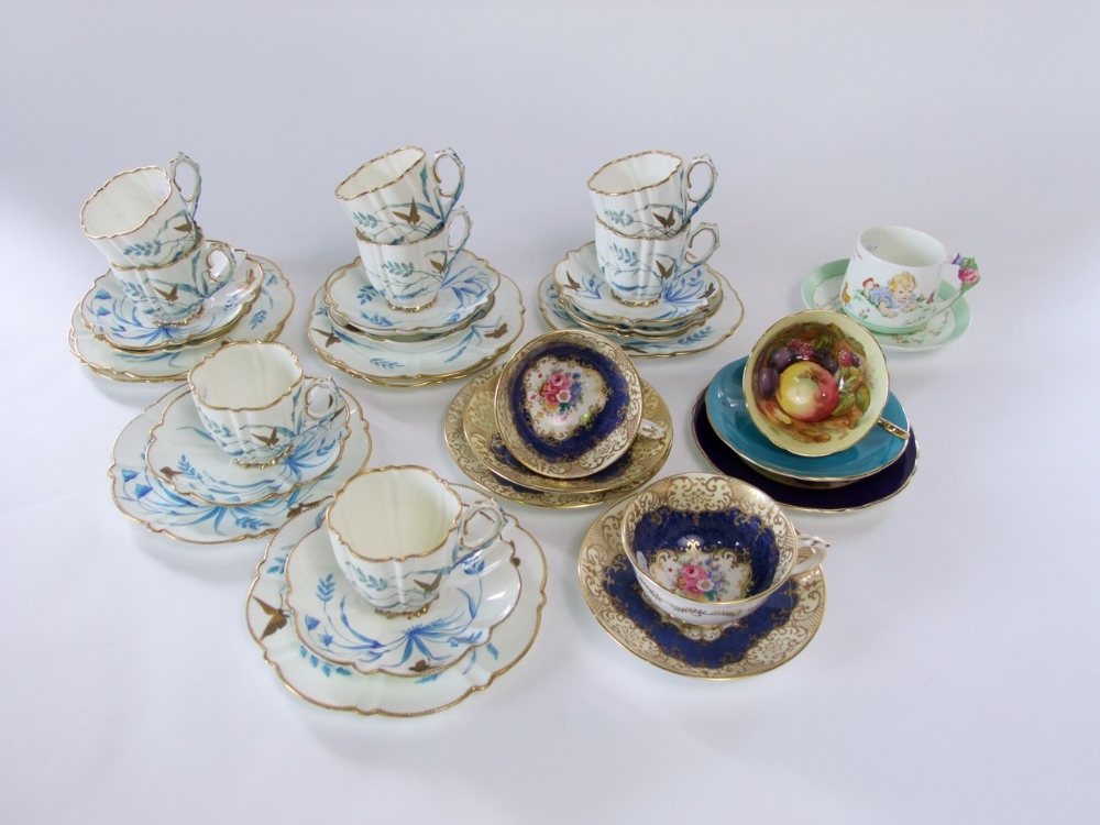 A collection of Victorian Ainsleys tea wares of fluted form with painted and gilded butterfly and