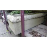 A contemporary heavy cast composition stone garden trough of rectangular form with acanthus and