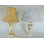 Two similar alabaster table lamps.