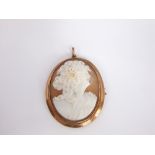 A 9ct gold shell cameo brooch depicting a classical female.