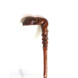 Carved walking stick the handle in the form of a recumbent lion with coled snake, 82cm long