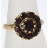 A Victorian 9k gold and Almandite (red) garnet ladies flower ring,ring size O, approx weight 4.5 g