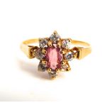 A 9k gold ruby and paste set flower ring, 1.5 g, ring size 'I'