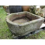 A good weathered limestone D end trough, 75 cm long maximum x 30 cm high approx.