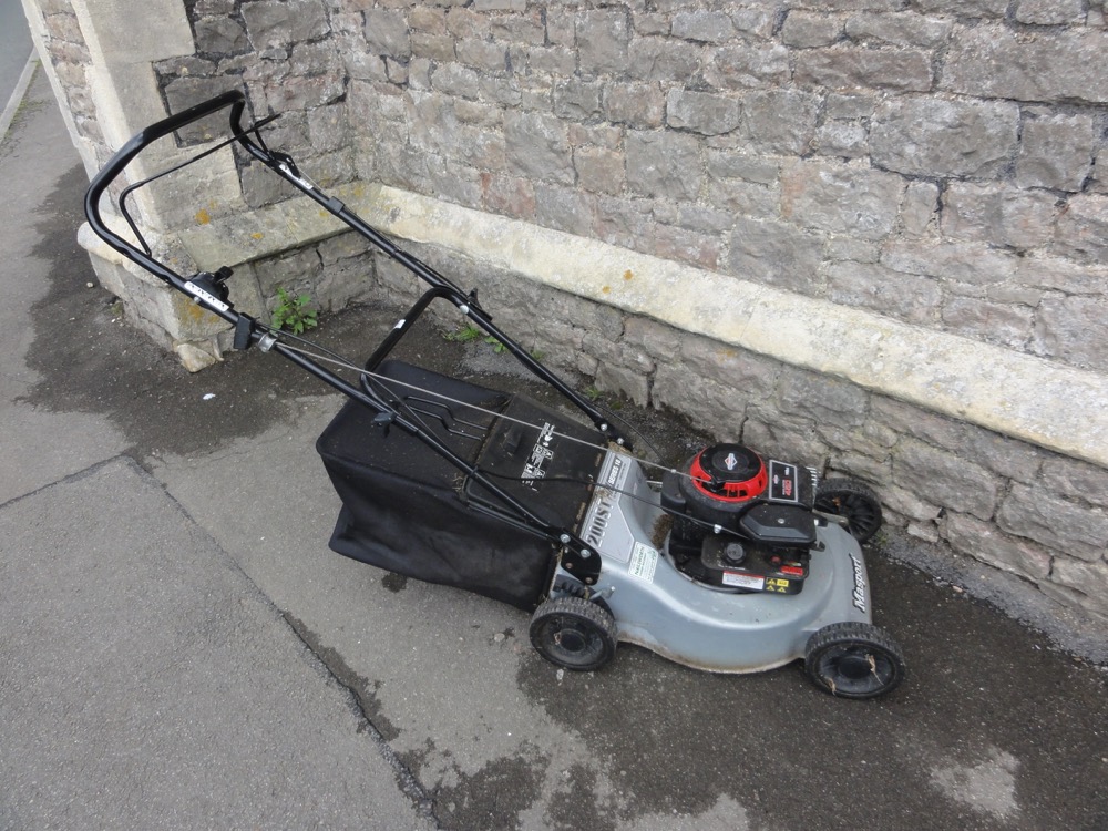 A Masport 200ST series 18 rotary mower with a Briggs & Stratton 148 cc engine with glass