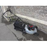 A Masport 200ST series 18 rotary mower with a Briggs & Stratton 148 cc engine with glass