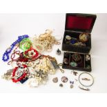 A collection of costume jewellery to include five white metal Scottish brooches, a silver St