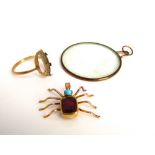 An early 20th century 9k gold Almandite garnet and turquoise cabochon spider pendant, 3.3g, together