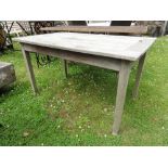 A Gloster weathered teak wood garden table with slatted top, 1.2 metres approx.