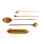 A small collection of 9k and yellow metal Etruscan style Victorian items to include a rose cut