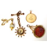 A 9k gold circular open photo pendant together with a yellow metal carnelian swivel watch fob, a