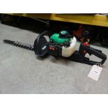 A Gardenline petrol hedge trimmer together with a Homelite Mightylite petrol strimmer