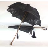 Two good 19th century parasols, one with elaborate horn crook handle with gilt met6al art nouveau