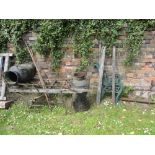 A pair of reproduction cast iron bench ends with pierced scroll work and lions mask detail, two