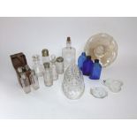 A collection of glassware to include glass jelly mould, three piece star cut glass cruet, three blue