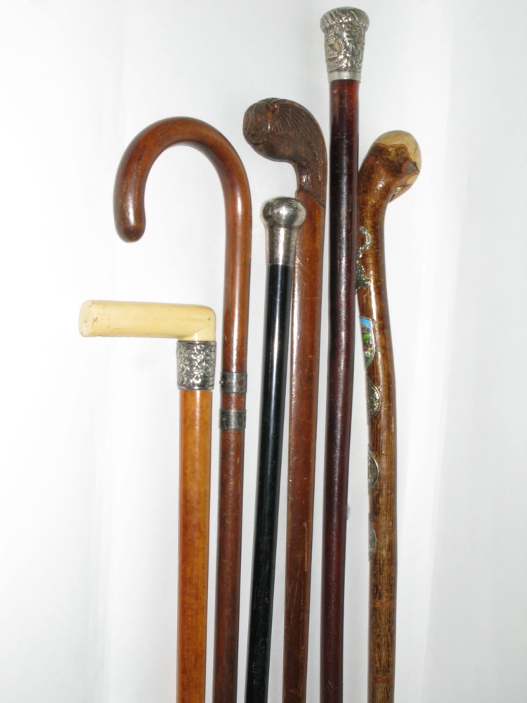 Collection of six walking sticks two with silver knops, one with ivory handle, etc