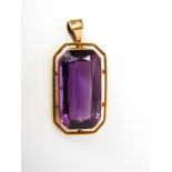 A 15ct gold free cut amethyst pendant 7.9g