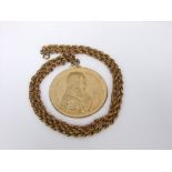 A gilt medallion - Louis X111 Art Medal (19th century) with gilt link neck chain