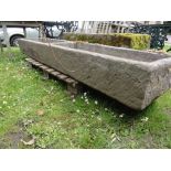 A good quality weathered limestone two divisional feeding trough, 220 cm long x 50 cm wide approx.