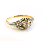 An unmarked white and yellow metal openwork ring with central brilliant cut cubic zirconia, size '