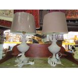 A pair of contemporary wooden urn shaped table lamps with painted finish raised on square cut