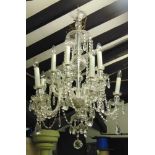 A good large Venetian glass ten branch step chandelier fitted with glass swags and prismatic