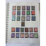 A loose leaf stamp album containing a quantity of British and worldwide stamps, a stockbook