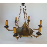 An Empire style six branch chandelier, the central column mounted by a flambeau finial over a base