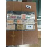 A stock book containing a collection of world stamps, various ages.