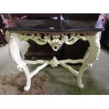 A console or pier table in the 18th century manner the shaped black marble top raised on a framework