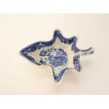 An early 19th century blue and white pickle dish modelled as a leaf, 14 cm long approximately