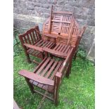 A pair of stained hardwood garden open armchairs with slatted seats and backs together with a