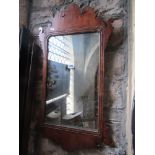 A Georgian style wall mirror the rectangular moulded frame with fretwork outline unusually in