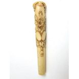 A Victorian carved bone parasol or walking stick handle with floral detail